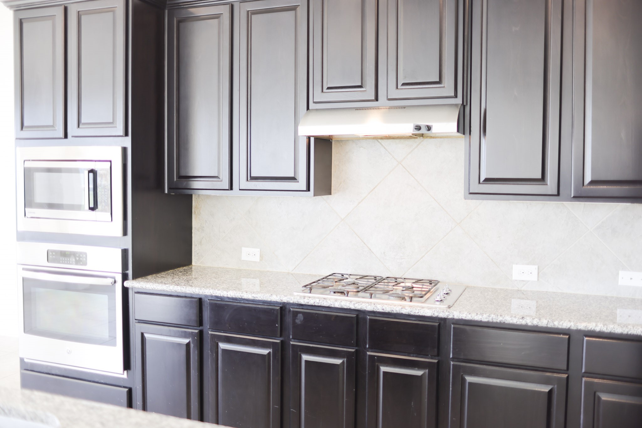 1236 Laurel Loop Angleton, TX 77515 - Photo 2 of 17 a kitchen with a sink cabinets and appliances