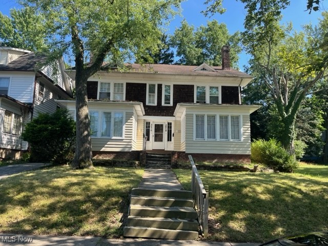 3214 Sycamore Road Cleveland, OH 44118 - Photo 1 of 18 View of front of property featuring a front yard and a chimney