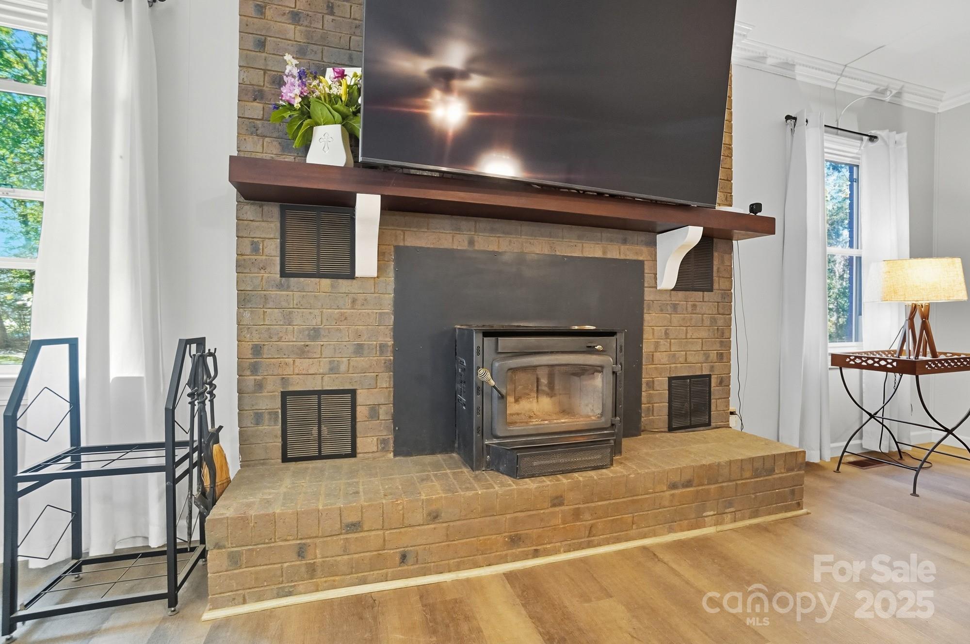 a bedroom with furniture and a fireplace