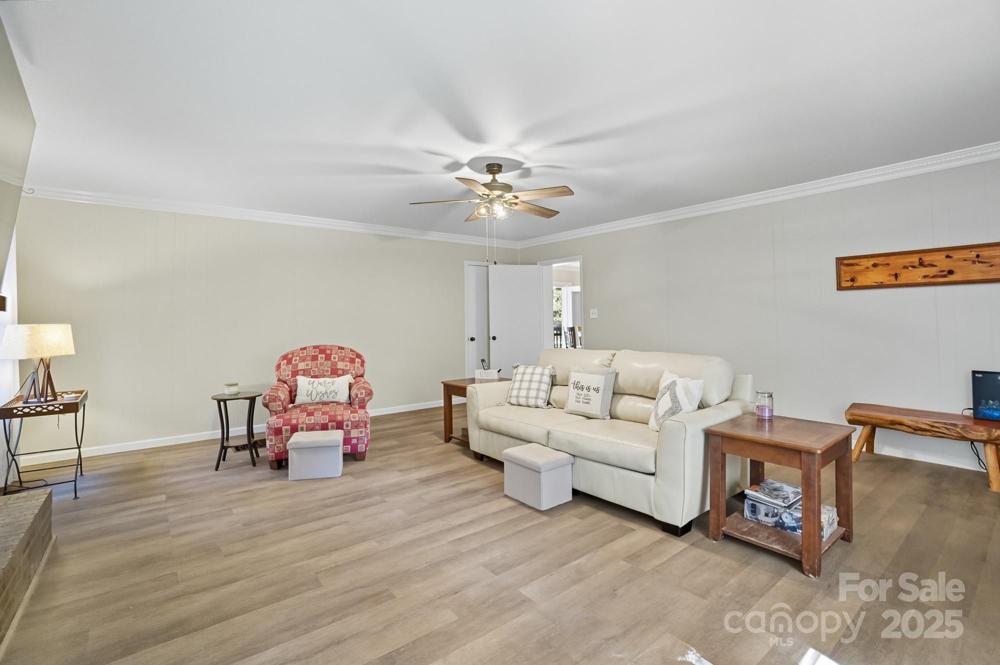 109 Carter Road Monroe, NC 28110 - Photo 16 of 48 a living room with furniture and a chandelier