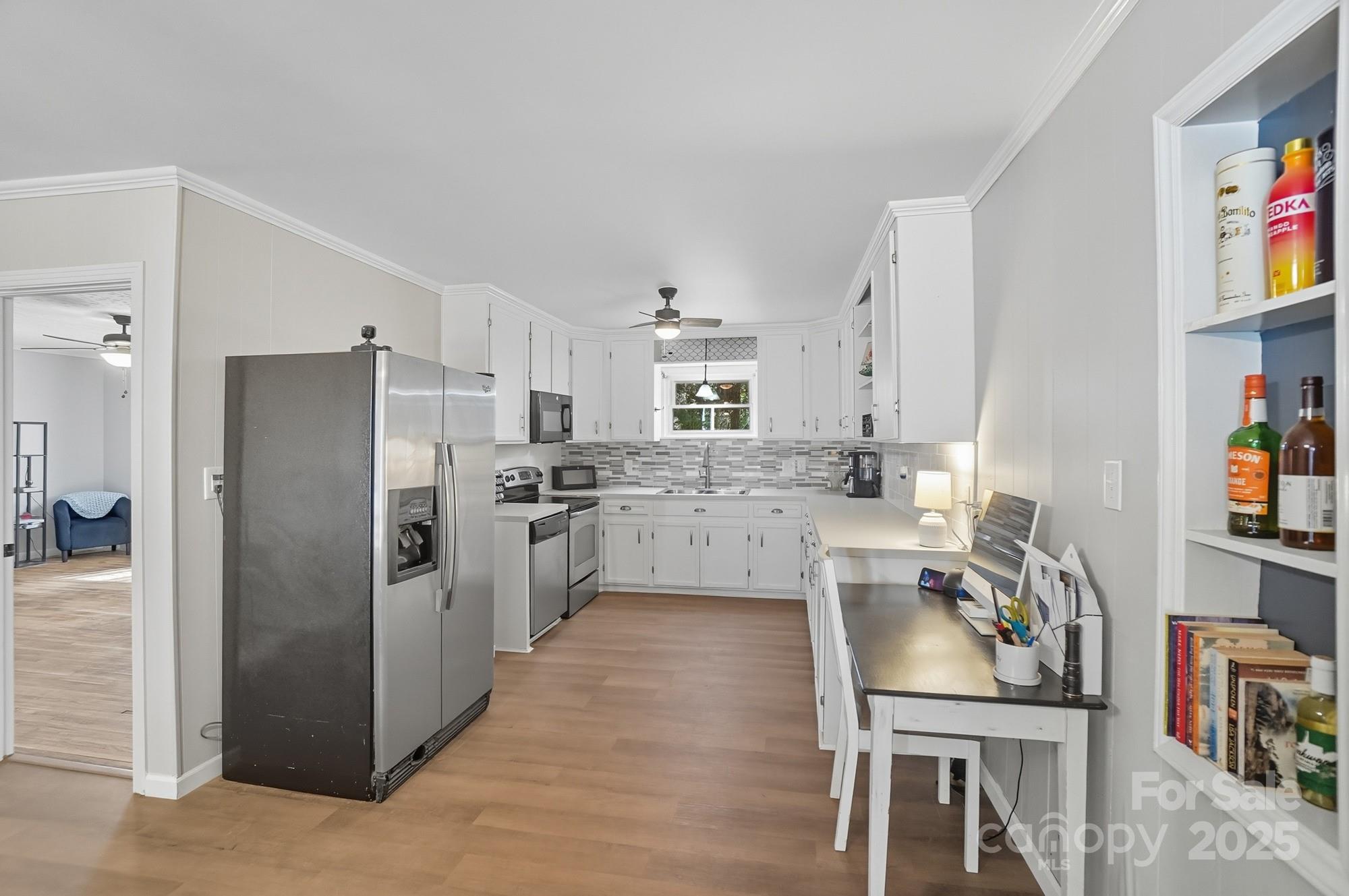 109 Carter Road Monroe, NC 28110 - Photo 17 of 48 a kitchen with stainless steel appliances granite countertop a refrigerator a stove and a cabinets