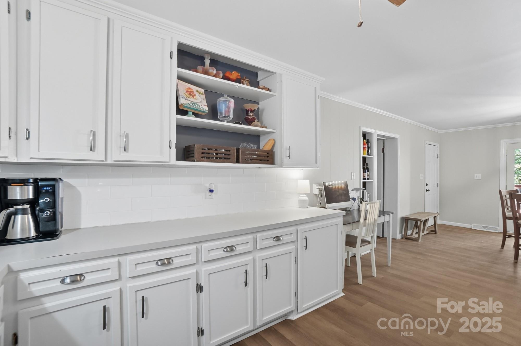 109 Carter Road Monroe, NC 28110 - Photo 19 of 48 a kitchen with white cabinets and sink