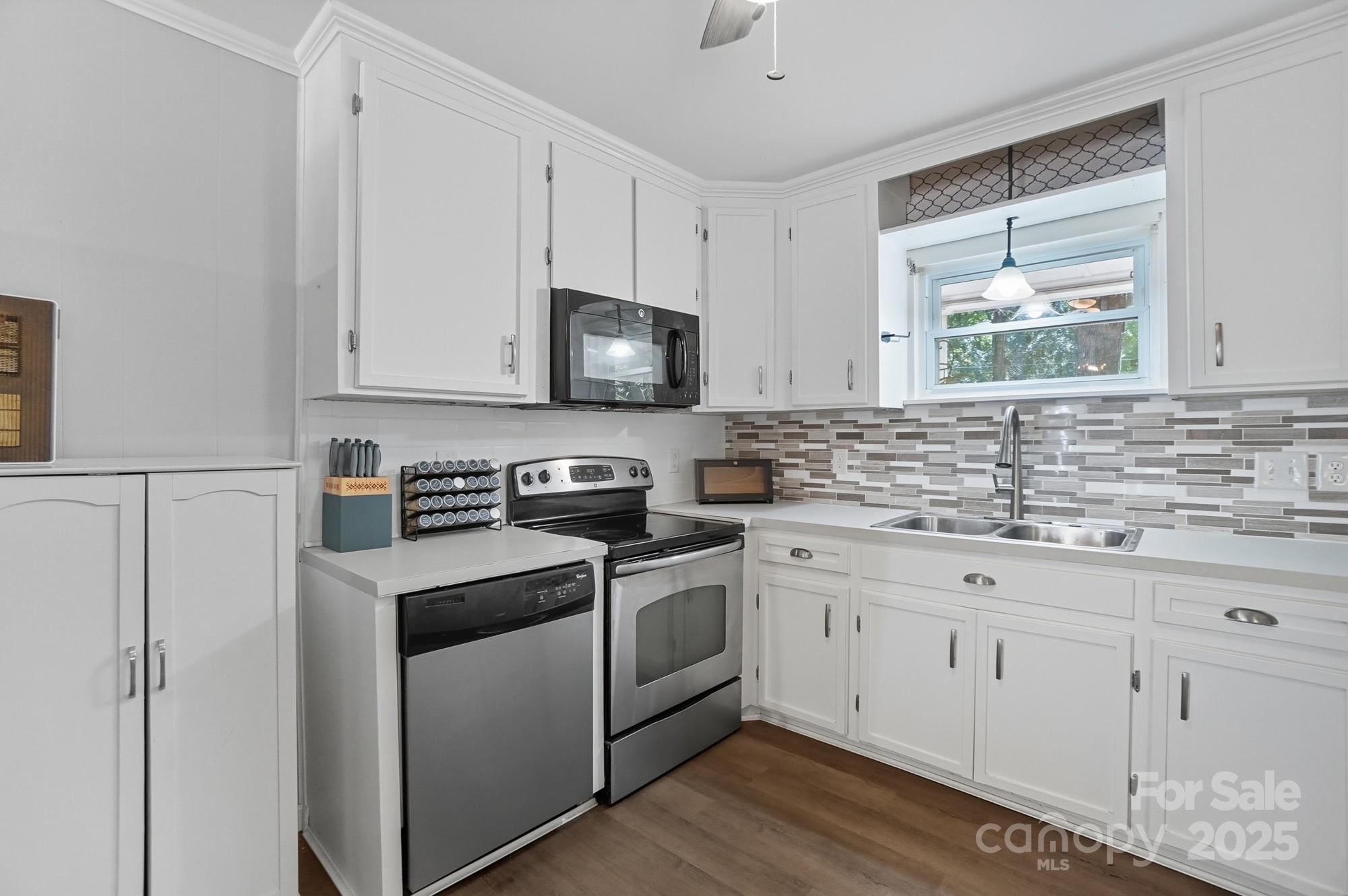 109 Carter Road Monroe, NC 28110 - Photo 21 of 48 a kitchen with appliances cabinets and a sink