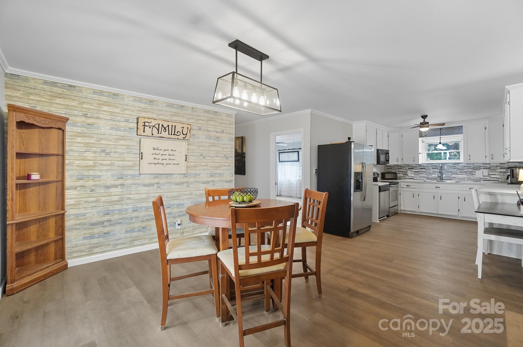 109 Carter Road Monroe, NC 28110 - Photo 24 of 48 a view of a dining room with furniture and wooden floor