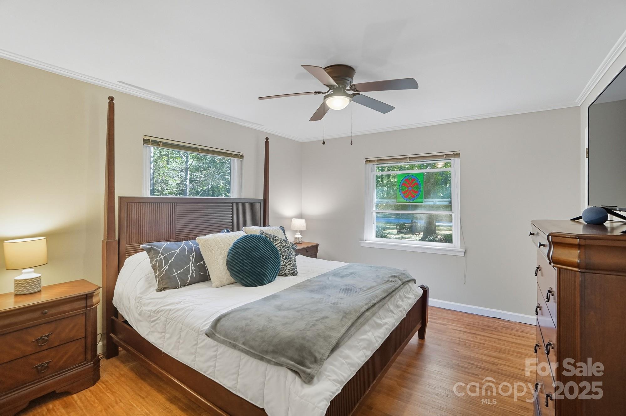 109 Carter Road Monroe, NC 28110 - Photo 30 of 48 a bedroom with a bed and wooden floor