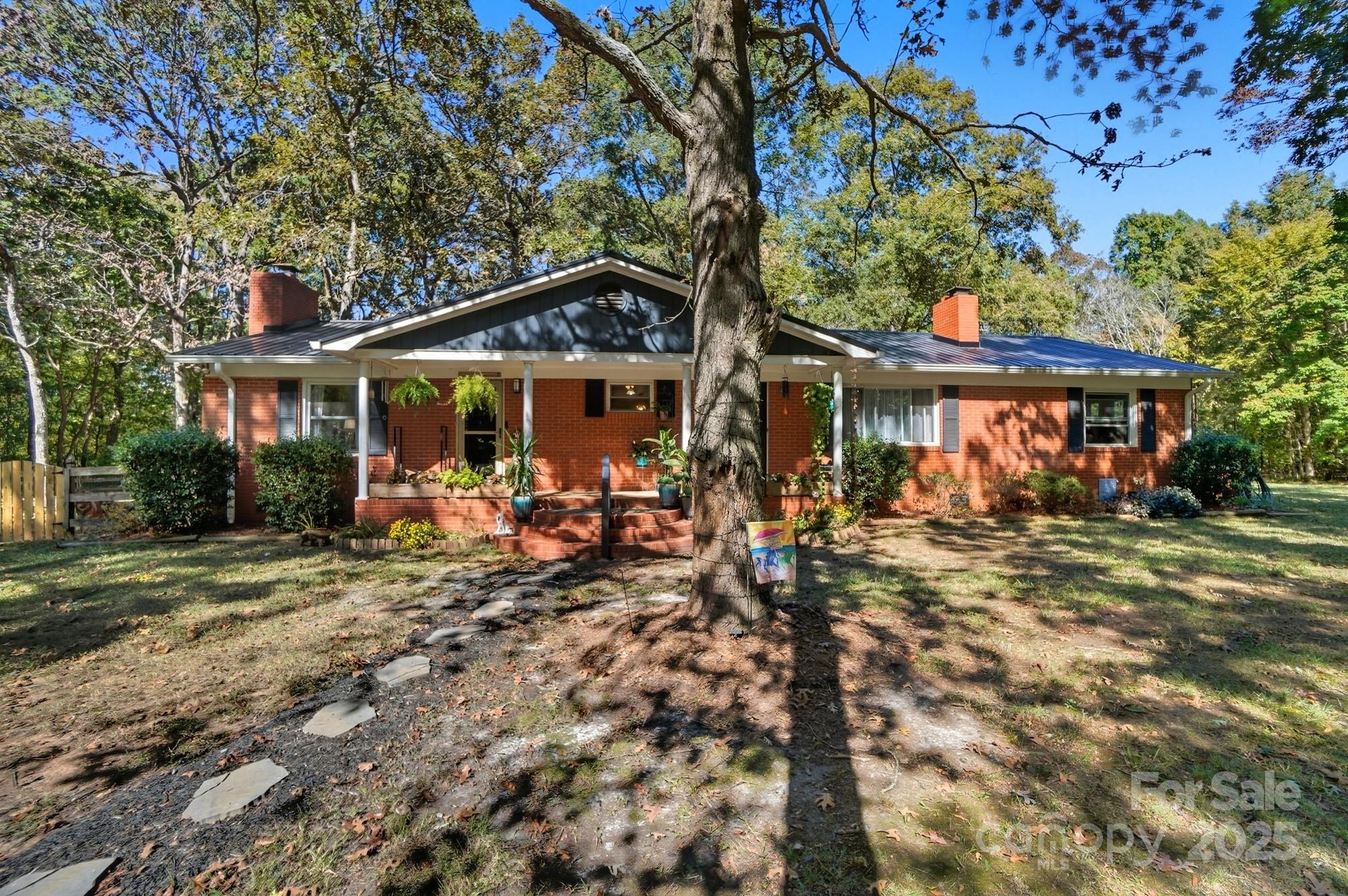 109 Carter Road Monroe, NC 28110 - Photo 3 of 48 a view of a table and chairs in patio