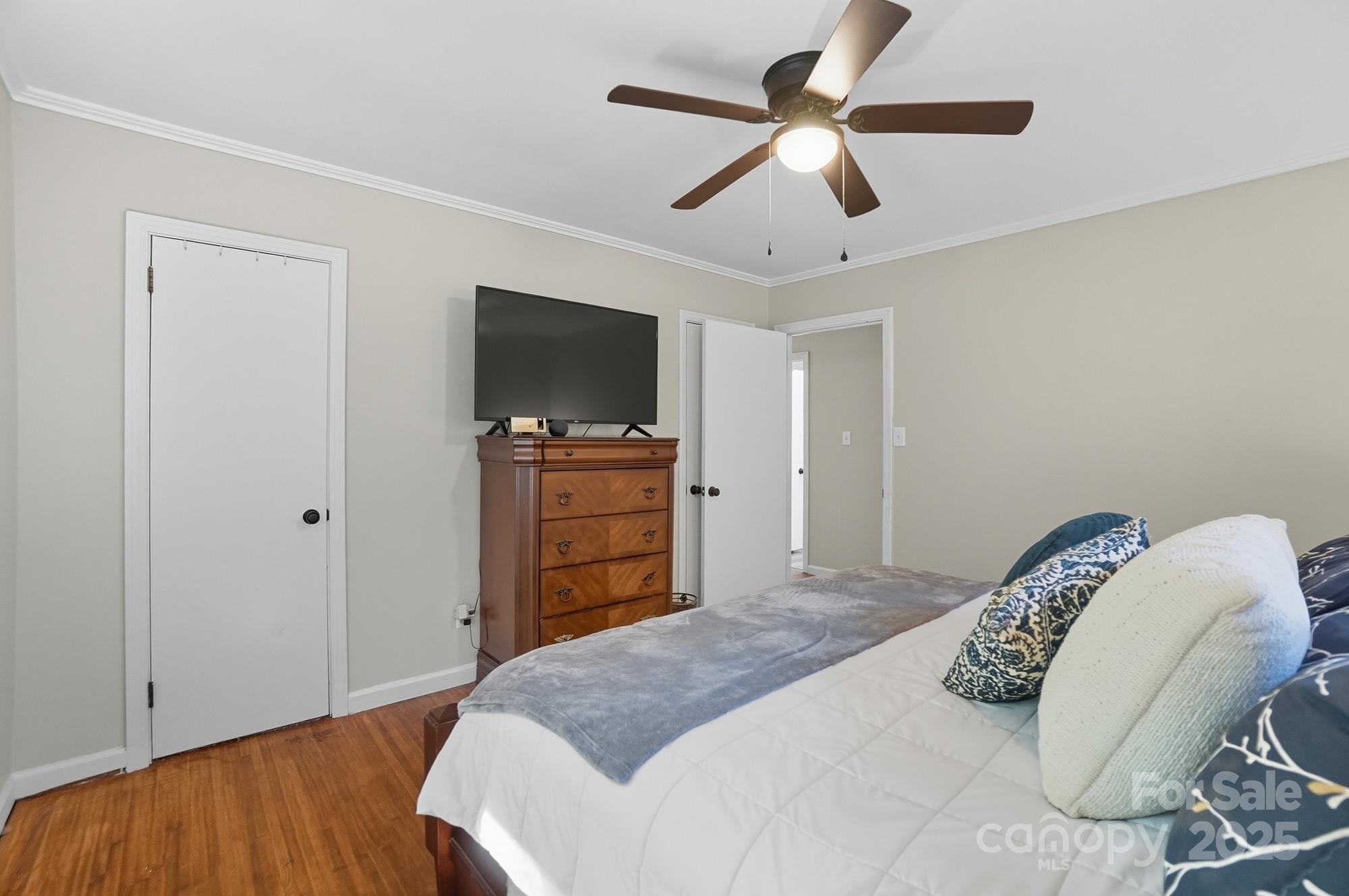 109 Carter Road Monroe, NC 28110 - Photo 32 of 48 a bedroom with a bed and a flat screen tv