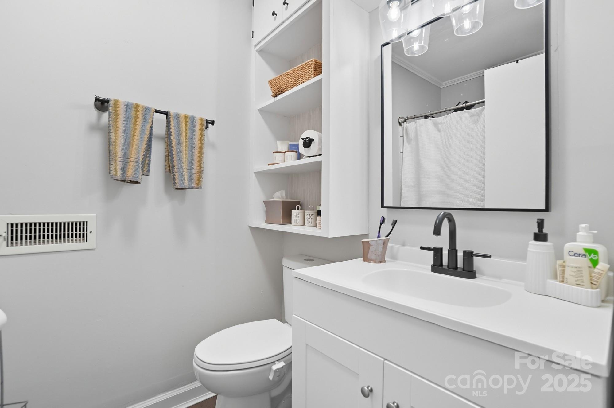 109 Carter Road Monroe, NC 28110 - Photo 33 of 48 a bathroom with a sink a toilet and mirror