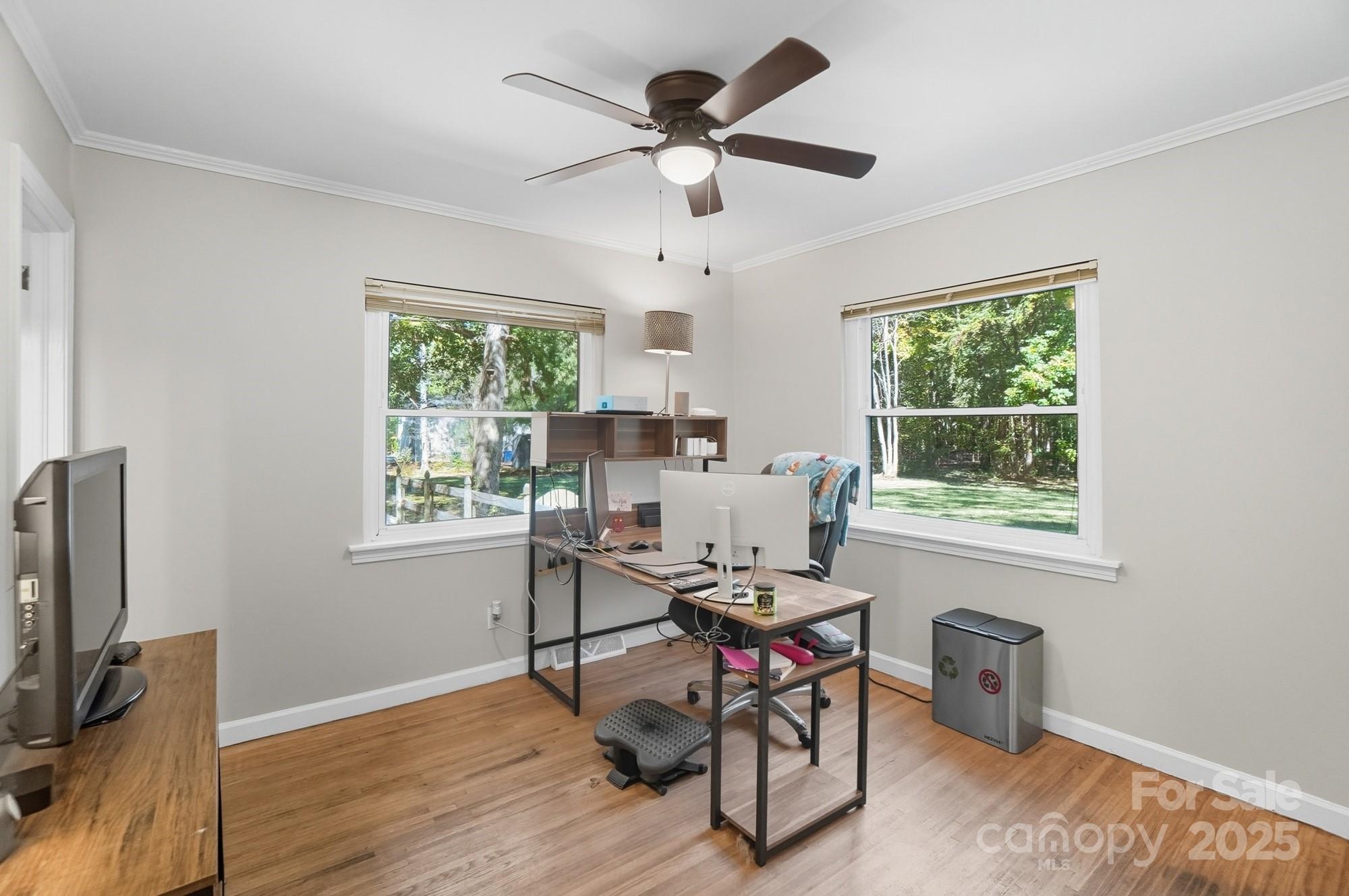 109 Carter Road Monroe, NC 28110 - Photo 35 of 48 a work room with furniture a flat screen tv and a window