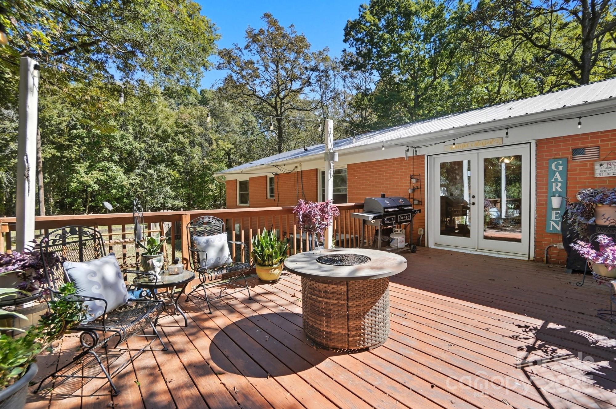 109 Carter Road Monroe, NC 28110 - Photo 40 of 48 a view of a chairs and tables on the roof deck