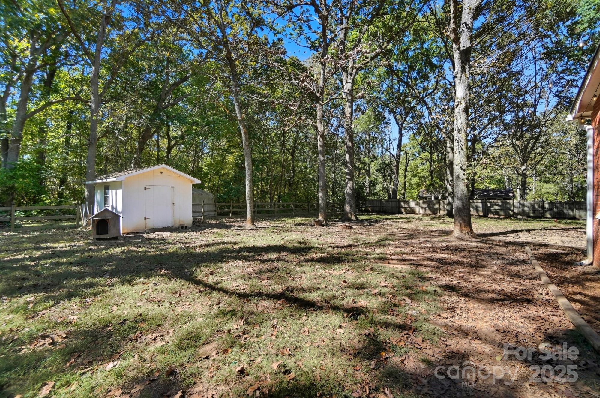 109 Carter Road Monroe, NC 28110 - Photo 43 of 48 a backyard of a house with a trees