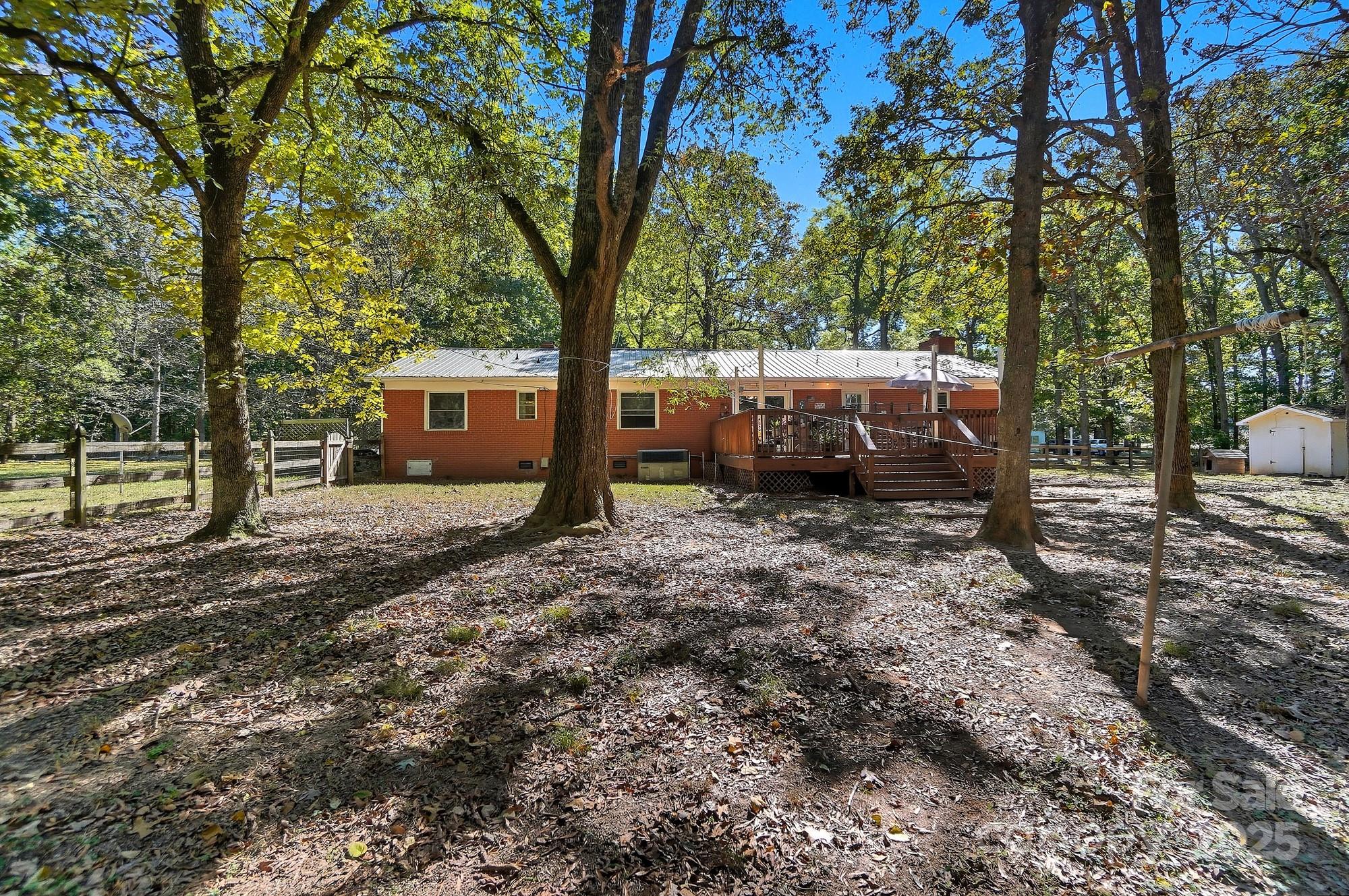 109 Carter Road Monroe, NC 28110 - Photo 45 of 48 a view of a house with backyard and a tree