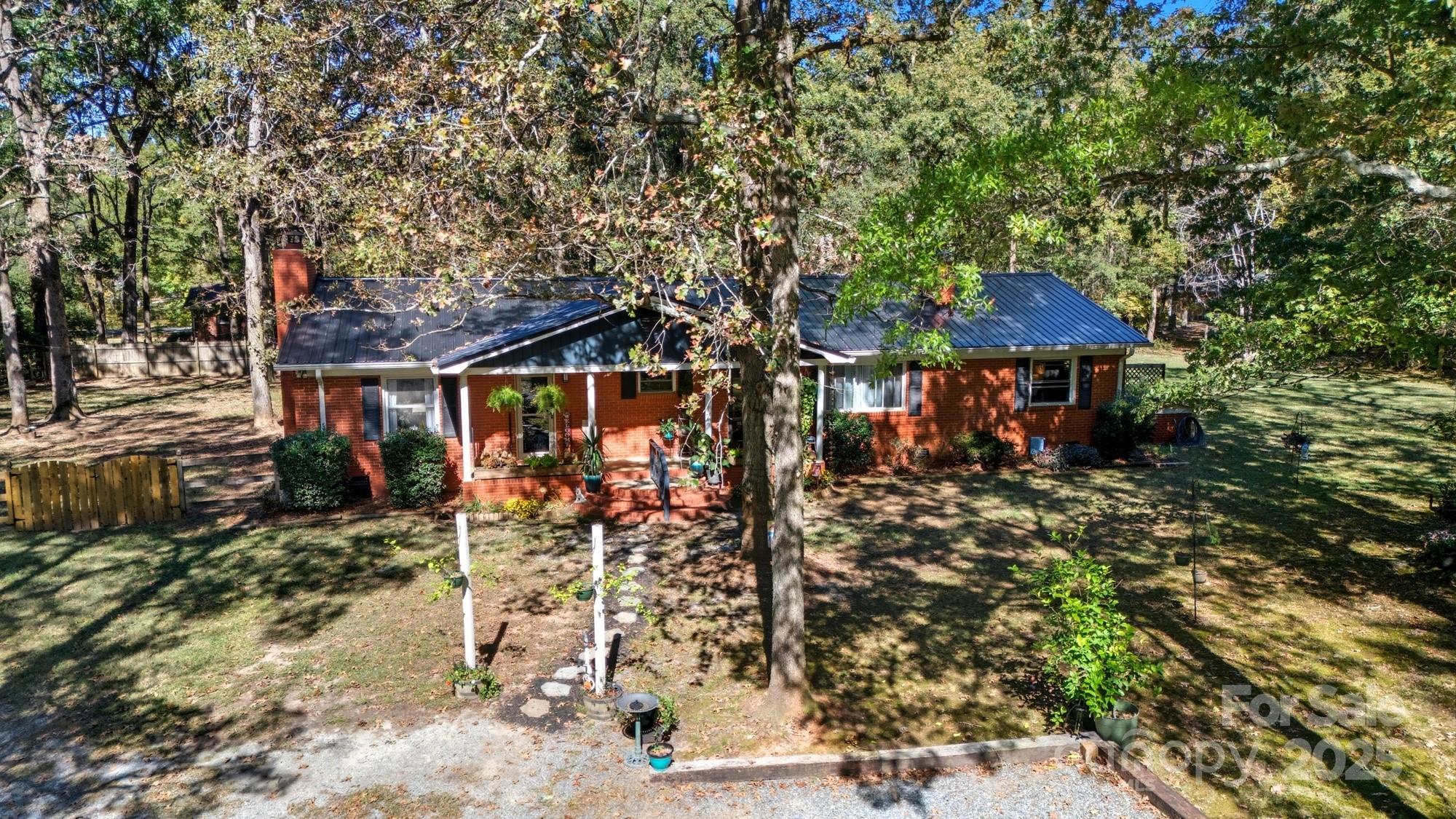 109 Carter Road Monroe, NC 28110 - Photo 5 of 48 a view of a chairs and table in the patio