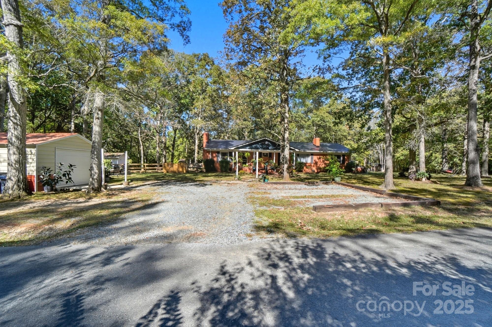 109 Carter Road Monroe, NC 28110 - Photo 7 of 48 a view of road with trees