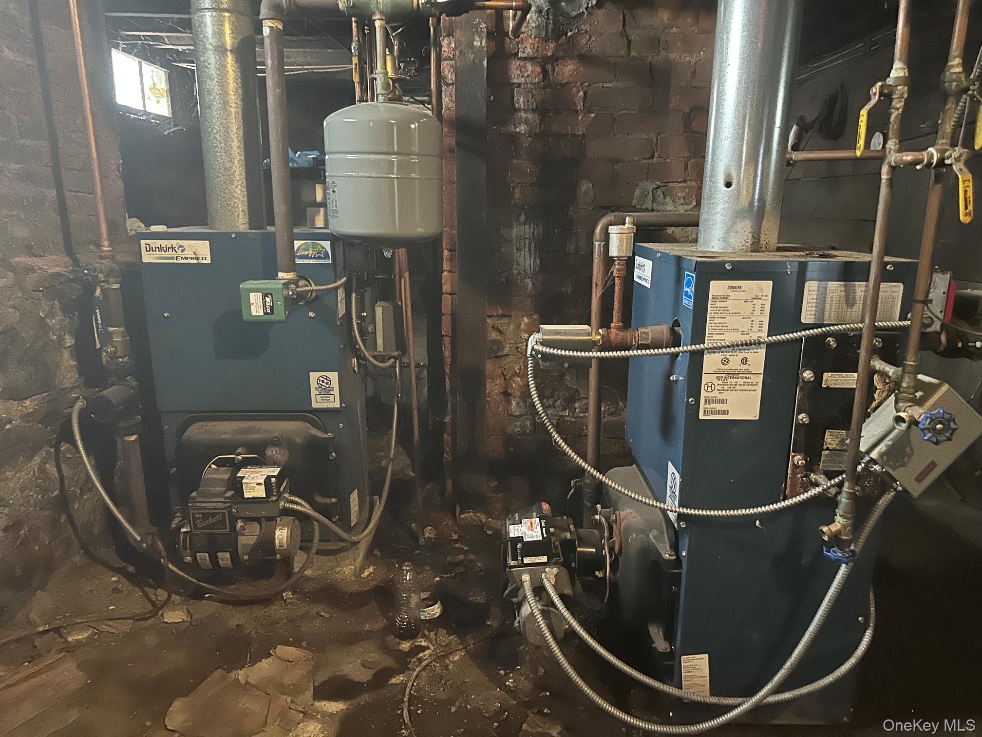 23 Virginia Poughkeepsie, NY 12601 - Photo 15 of 18 3 heating systems,1 separate hot water heater-2 others heat off coil, gas meters, storage, electrical panel box