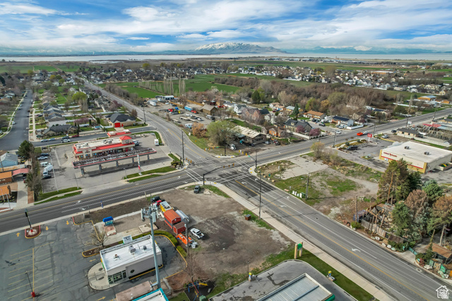 34 North Geneva Road Provo, UT 84601 - Photo 13 of 24 Expansive aerial perspective showcasing a commercial intersection, multiple commercial buildings, and surrounding residential areas
