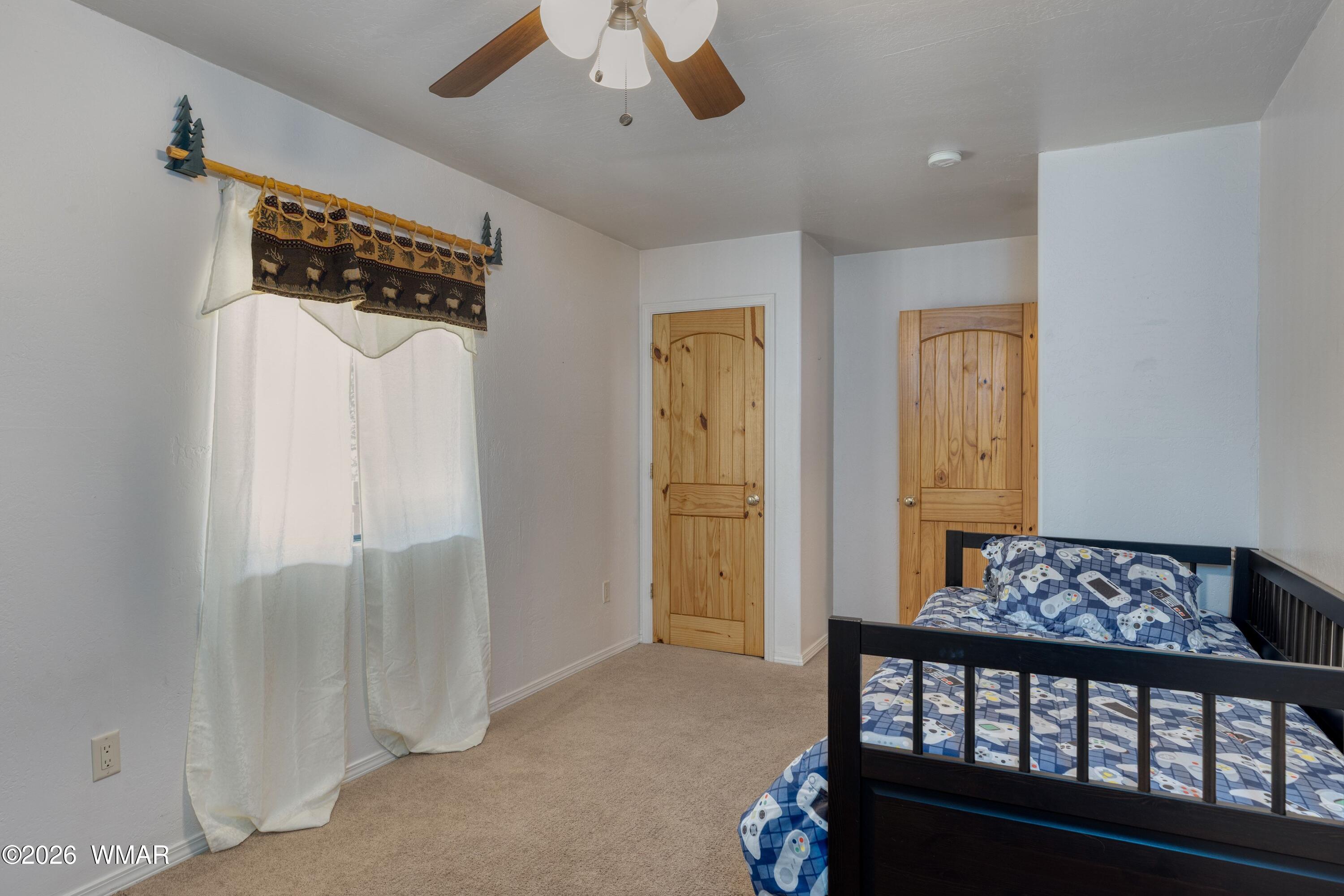 2722 Bain Trail Overgaard, AZ 85933 - Photo 11 of 28 a view of a bedroom with furniture and wooden floor