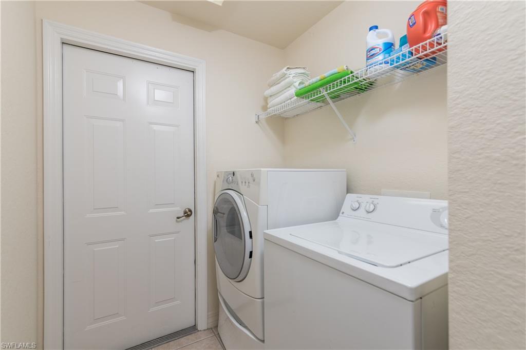15079 Sterling Oaks Drive Naples, FL 34110 - Photo 18 of 29 a utility room with dryer and washer