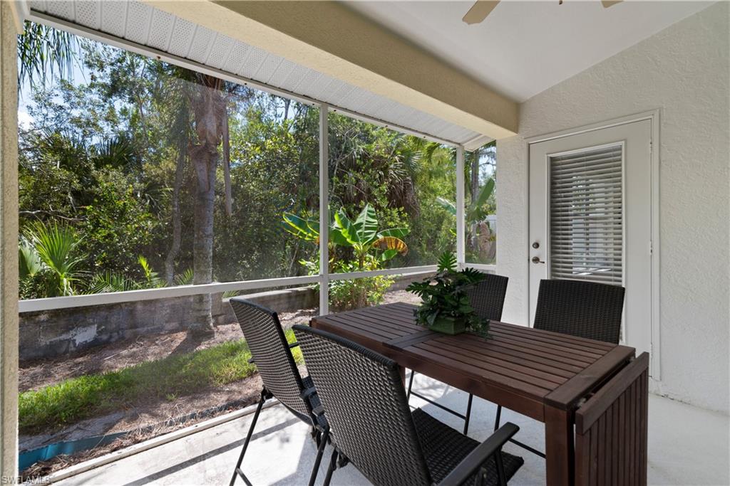 15079 Sterling Oaks Drive Naples, FL 34110 - Photo 20 of 29 a view of a dining room with furniture window and outside view