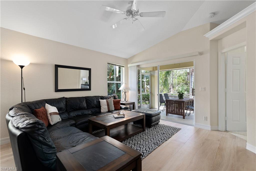 15079 Sterling Oaks Drive Naples, FL 34110 - Photo 2 of 29 a living room with furniture and a window