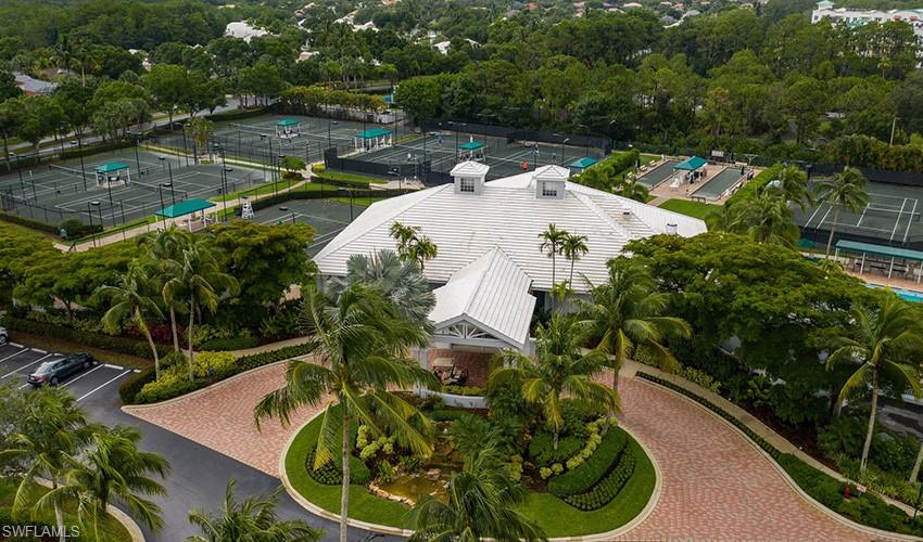 15079 Sterling Oaks Drive Naples, FL 34110 - Photo 24 of 29 a view of a swimming pool with a yard and plants