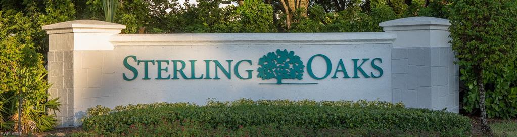 15079 Sterling Oaks Drive Naples, FL 34110 - Photo 25 of 29 a view of outdoor space with signage and flags