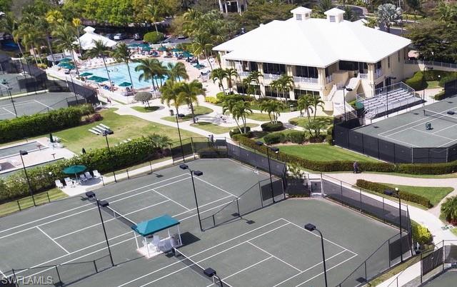 15079 Sterling Oaks Drive Naples, FL 34110 - Photo 27 of 29 an aerial view of a house with swimming pool and outdoor seating