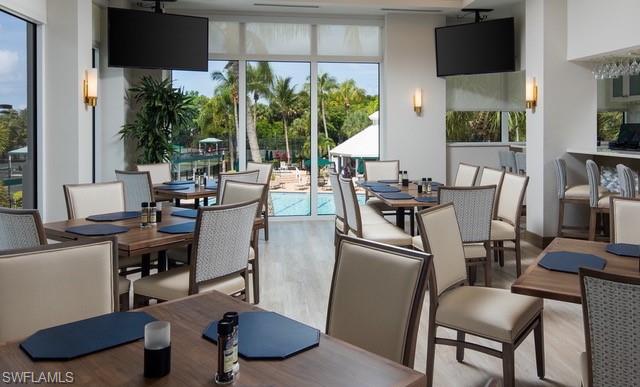 15079 Sterling Oaks Drive Naples, FL 34110 - Photo 28 of 29 a view of a workspace with furniture and a window