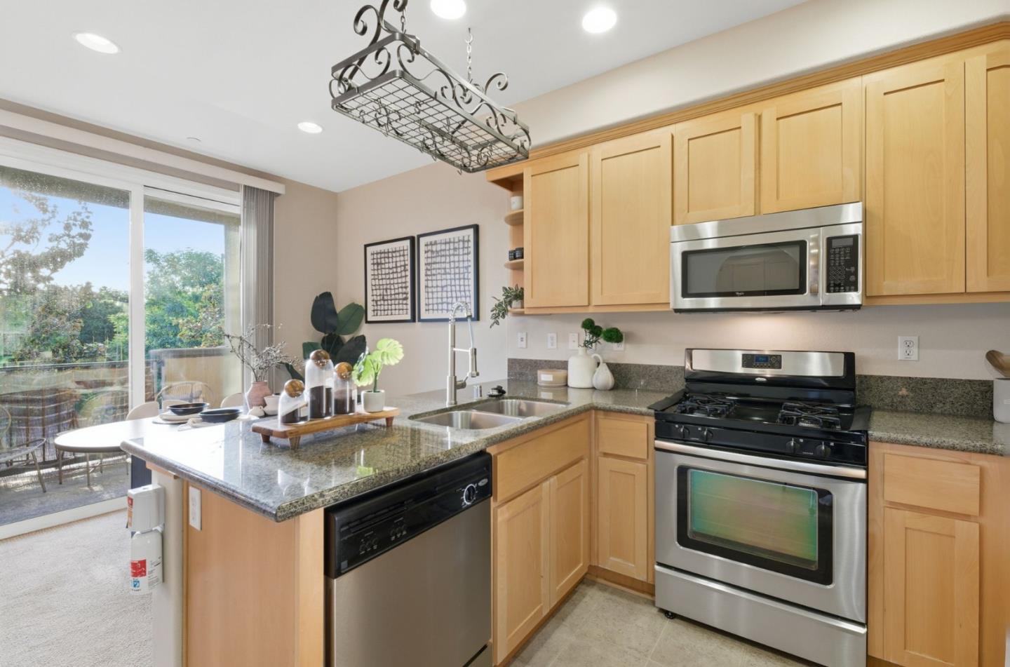 2070 Almaden Road San Jose, CA 95125 - Photo 11 of 36 a kitchen with stainless steel appliances a stove sink microwave and cabinets
