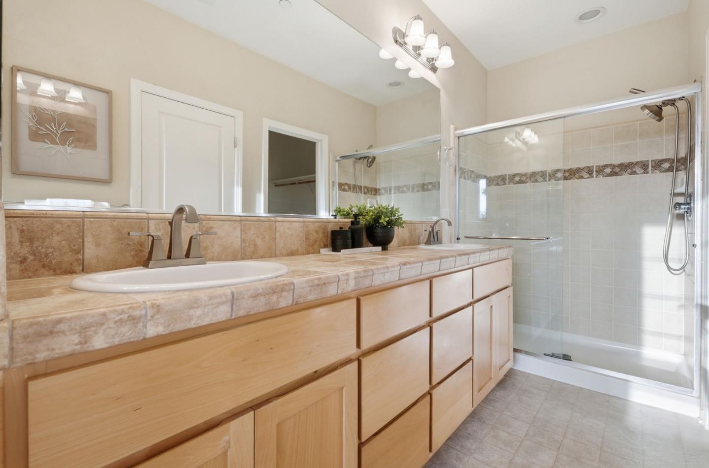 2070 Almaden Road San Jose, CA 95125 - Photo 21 of 36 a bathroom with a double vanity sink mirror and shower