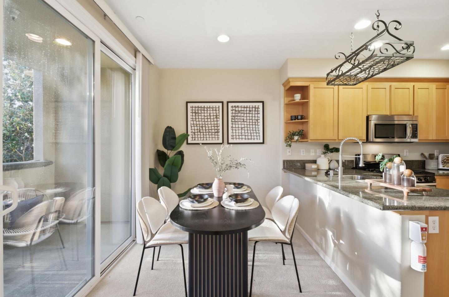2070 Almaden Road San Jose, CA 95125 - Photo 9 of 36 a view of a dining room with furniture a kitchen and chandelier