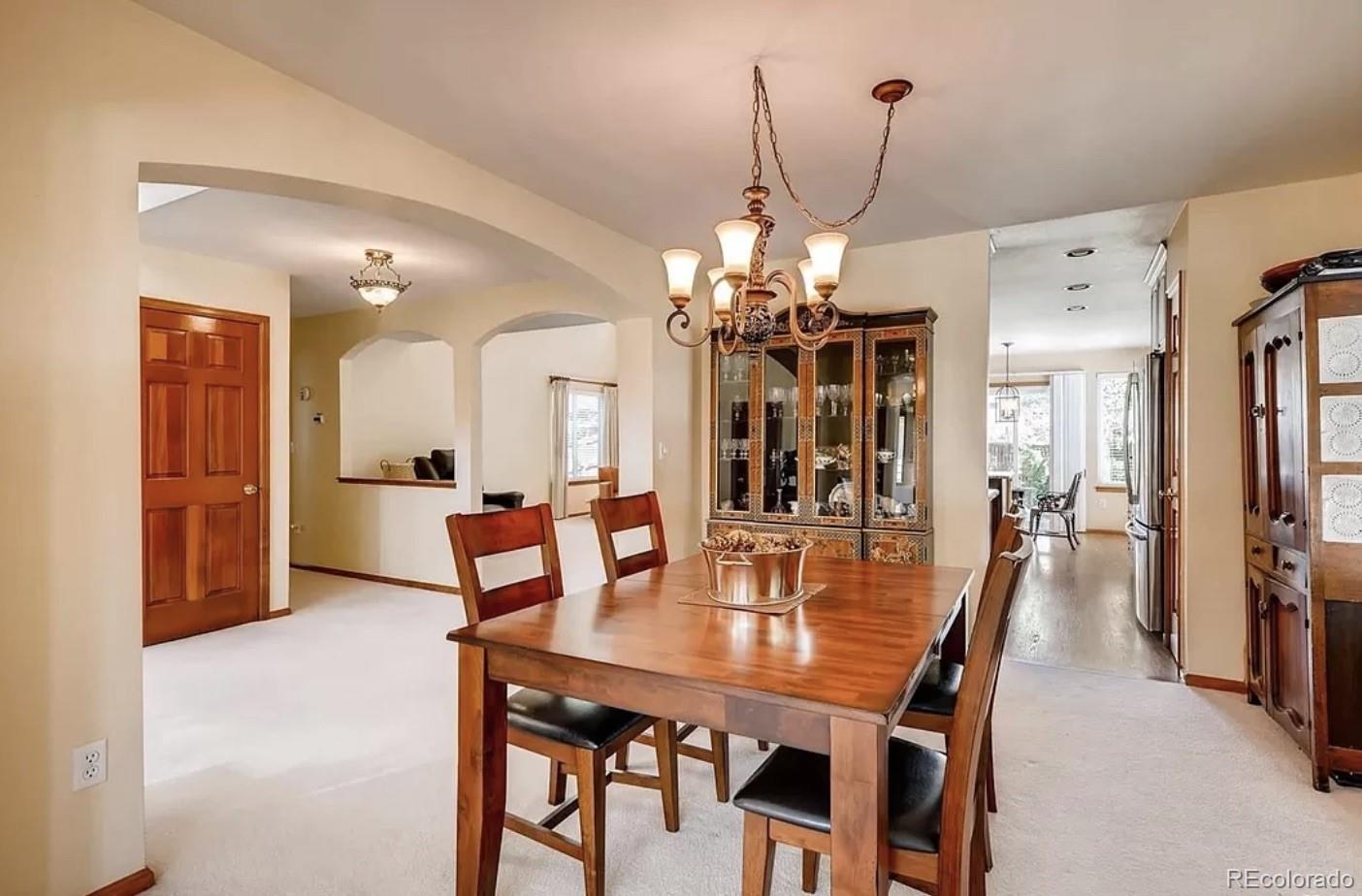 9832 South Spring Hill Place Highlands Ranch, CO 80129 - Photo 6 of 25 a view of a dining room and livingroom with furniture