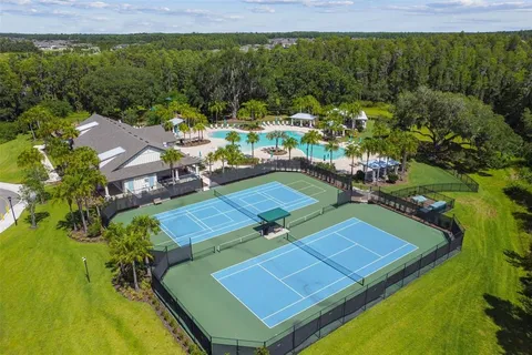 a view of a pool with a garden