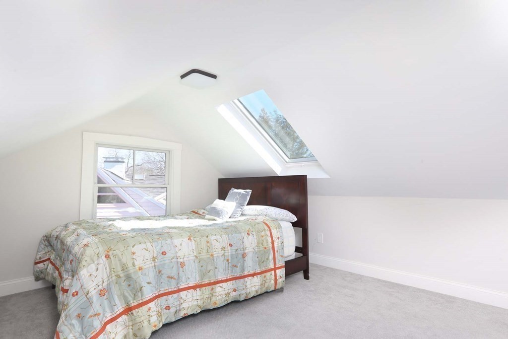 10 Beverly Road Newton, MA 02461 - Photo 13 of 19 a bedroom with a bed and window