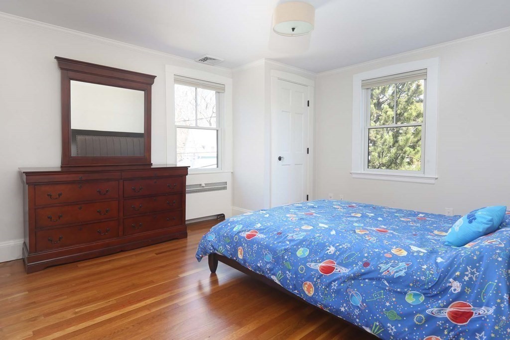 10 Beverly Road Newton, MA 02461 - Photo 14 of 19 a bedroom with a bed and a dresser