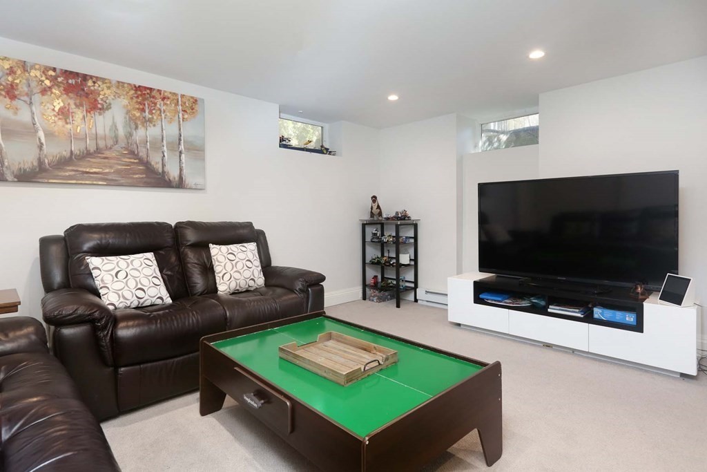 10 Beverly Road Newton, MA 02461 - Photo 16 of 19 a living room with furniture and a flat screen tv