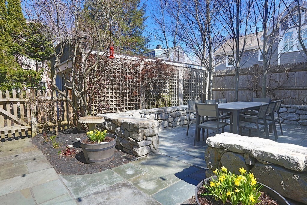 10 Beverly Road Newton, MA 02461 - Photo 18 of 19 a view of a patio with table and chairs and potted plants