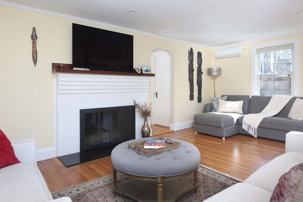 10 Beverly Road Newton, MA 02461 - Photo 4 of 19 a living room with furniture and a fireplace
