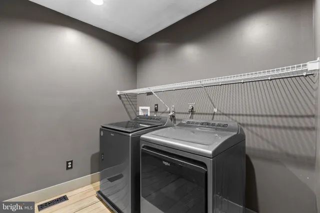 a utility room with washer and dryer