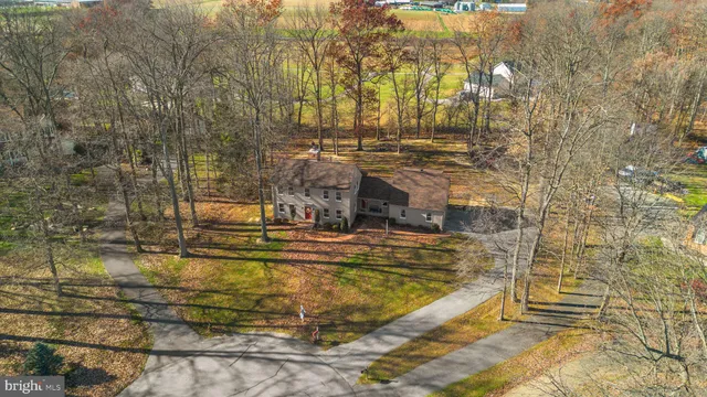 a view of roof deck with wooden fence and plants