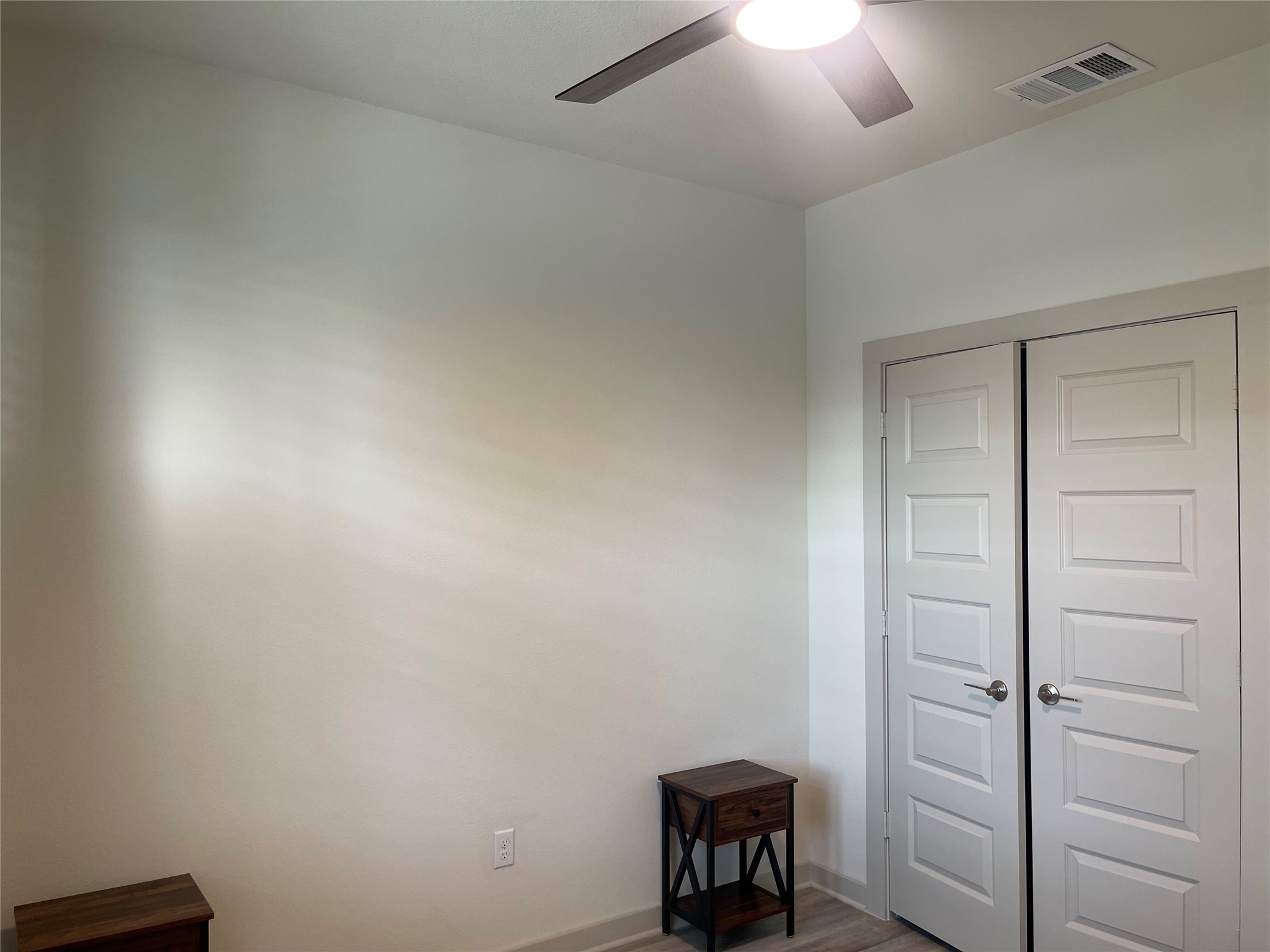 145 Merrick Road Georgetown, TX 78628 - Photo 25 of 32 Smooth neutral walls and wood-look flooring establish a clean, contemporary design palette.