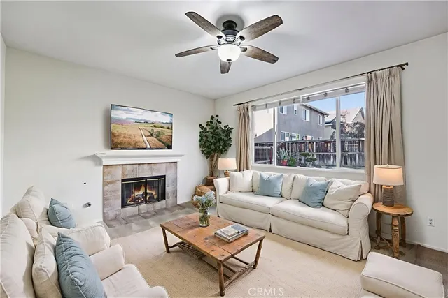 a living room with furniture and a fireplace