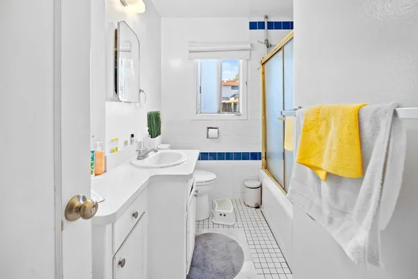 a bedroom with baby bed and window