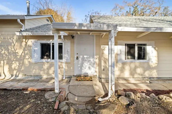 a front view of a house with a outdoor space