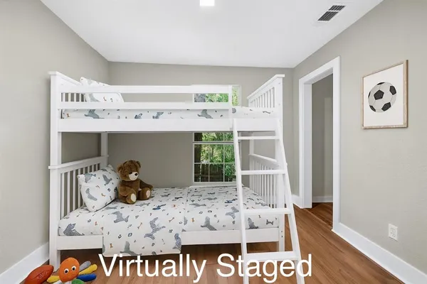 a bed room with a bed and a window