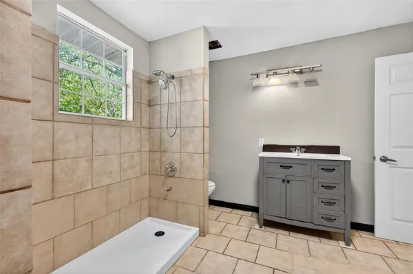 a bathroom with a bathtub and a shower