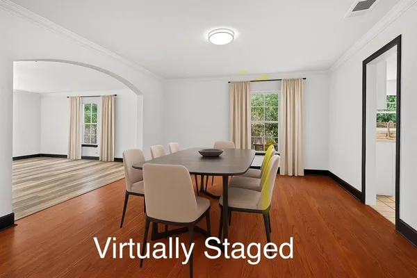 a view of a dining room with furniture window and wooden floor