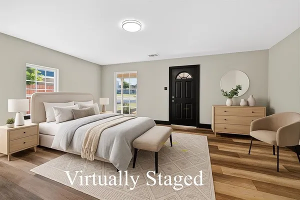 a bedroom with a bed and a dresser