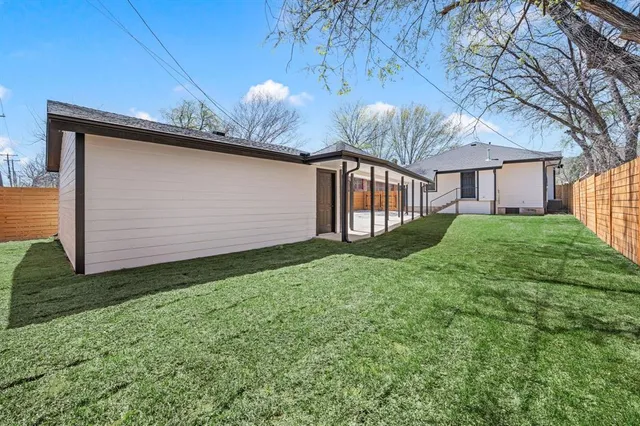 a view of a backyard of the house