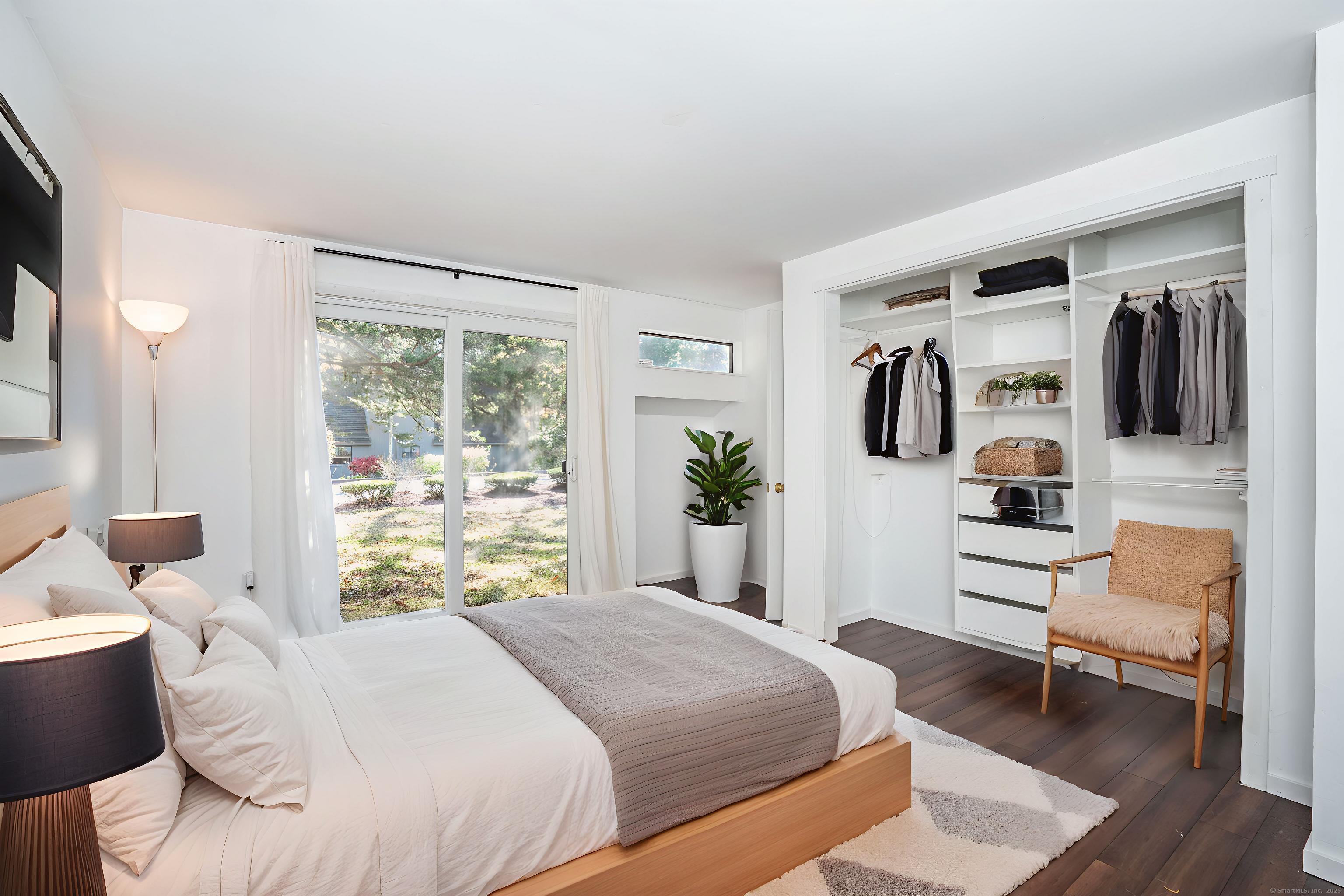 1 Morningside Court, Unit 1 Avon, CT 06001 - Photo 18 of 31 a bedroom with a bed and a chair